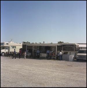 Primary view of object titled '[Trailer store in the Wells parking lot]'.