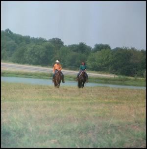 [Two Horse Riders by a Lake]