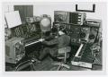 Photograph: [An unidentified man using the Moog at the NTSU Electronic Music Cent…