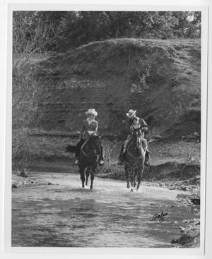 [Man, Woman and a Child riding horseback]