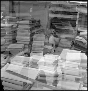 [Bookbinder at station, double exposure]