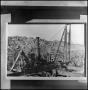 Photograph: [Print of workers on crane]