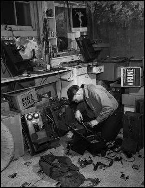 [Man repairing a telephone]