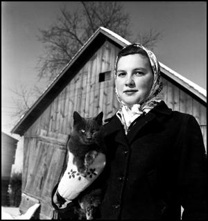 [Portrait of a woman holding a cat]