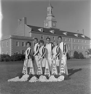 [Six cheerleaders in front of the Hurley Administration Building]