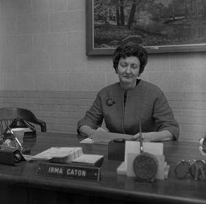 [Dr. Irma Canton sitting behind her desk, 5]