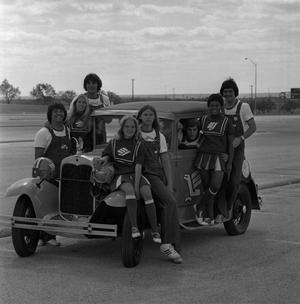 [Group shot of NTSU cheerleaders on a car, 5]