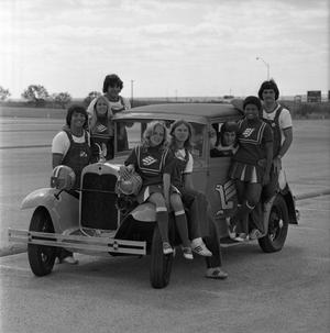 [Group shot of NTSU cheerleaders on a car, 3]