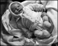 Photograph: [Baby Junebug laying in a blanket, 2]