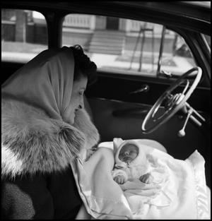 [Bernice holding baby Junebug in an automobile, 2]