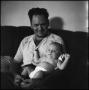 Photograph: [Joe Clark and Junebug on a couch, 8]