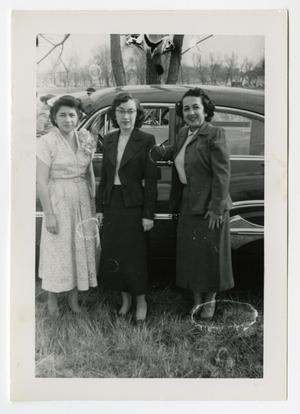 [Three woman in front of car]