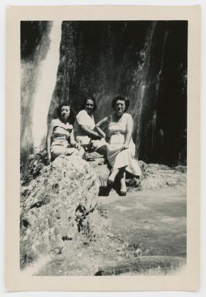[Three women posing on rocks]