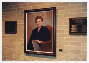 [Portrait of Sarah T. Hughes on wall]