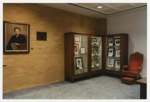 [Sarah T. Hughes Reading Room portrait and display cases 1]