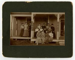 [Group of women on the porch of a boarding house]