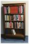 Primary view of [Bookshelf in the Sarah T. Hughes Reading Room]