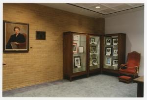 [Sarah T. Hughes Reading Room portrait and display cases 2]