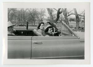 [Carolina Cuellar Ayala, Mary Cuellar Alvarado and Macario Cuellar driving in a car]