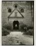 Photograph: [Photograph of a man in the doorway of Mission Concepción in San Anto…