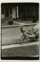 Photograph: [Photograph of Carol Williams riding a tricycle]