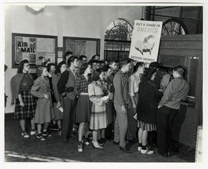 [Students line up in the NT Post Office to buy World War II war bonds]