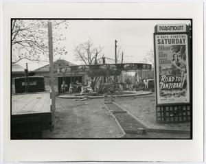 [Print photograph of a carousel and movie poster, 2]