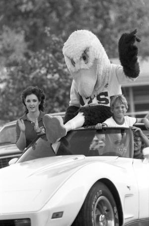 ["Eppy" riding in the Homecoming Parade, 3]