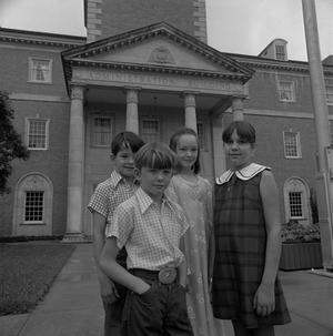 [Four children in front of the Hurley Administration building, 5]