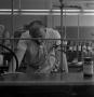 Thumbnail image of item number 1 in: '[Chemistry student in the lab]'.