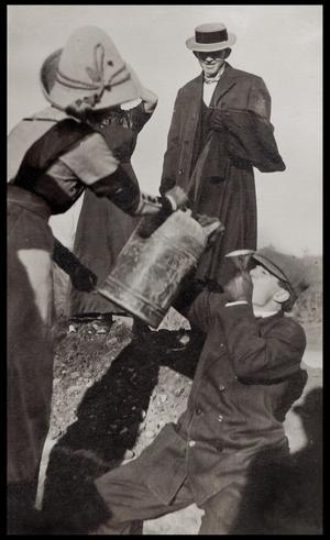 [People drinking from a gas can]