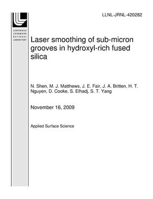 Laser smoothing of sub-micron grooves in hydroxyl-rich fused silica