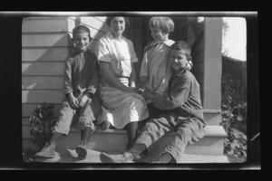 [Irene Biffle Williams sitting on a porch with her sons]