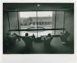Thumbnail image of item number 1 in: '[Students seated  in chairs by large window in A. M. Willis, Jr. Library]'.