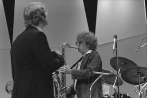 [Photograph of Neil Slater and Saxophonist]