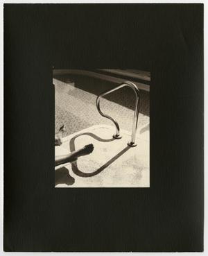 [Photograph of a poolside lounger]