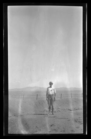 [Byrd Williams Jr. standing in the desert]