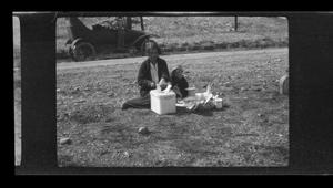 [Irene Williams setting up a picnic with her son Charles]