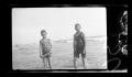Photograph: [John and Byrd Williams, III, standing on a beach]