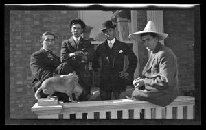 [Johnson Williams and three other men with a dog]