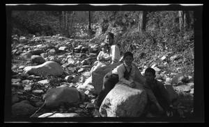 [The Williams family posing in a creek bed]