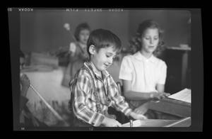 [Byrd Williams IV and other children playing in a room]