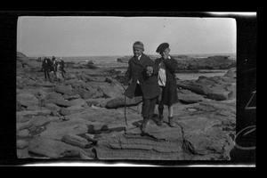 [Byrd III, and John Williams standing on a rocky shoreline]