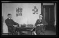Photograph: [Byrd Williams Jr. and brother Johnson, sitting in their dorm at U.T.]