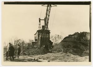 [Three men looking at the construction site of the new Administration Building, 1920s]