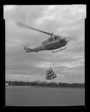 [The XH-40 # 3 in flight with a cargo sling]