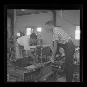 Primary view of object titled '[Bell employees working on parts for the XH-40]'.
