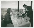 Photograph: [Two People Seated at a Table at La Ronde Rotating Restaurant]