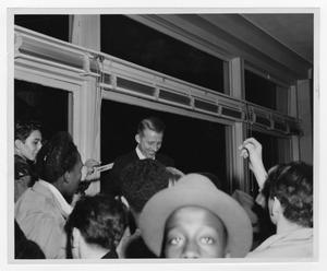 Primary view of object titled '[Kenton signing autographs at Schirmer opening]'.