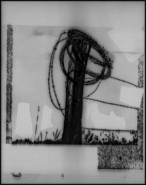 [Photographic slide of a barbed wire fence post]